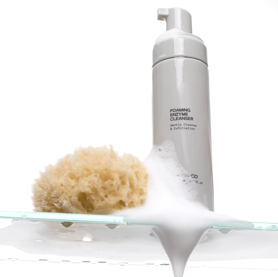 INSKIN.CO Foaming Enzyme Cleanser styled with cleansing sponge and foaming texture highlighting enzyme-based exfoliating cleanser.