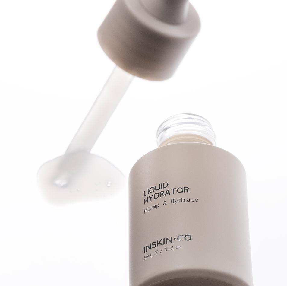 INSKIN.CO Liquid Hydrator open bottle with dropper dispensing lightweight hydrating fluid for barrier support and skin balance.