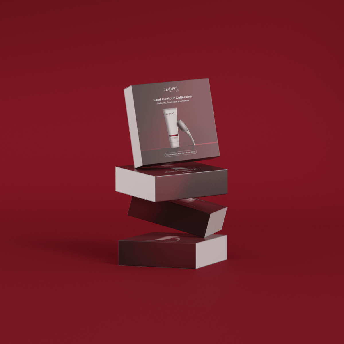 Multiple Aspect DR Cool Contour Limited Edition Kits stacked together against a red Christmas backdrop, showcasing holiday gift-ready skincare set.