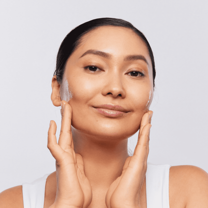 Woman lathering Aspect Gentle Clean 220ml to demonstrate the silky, mildly foaming gel texture that gently exfoliates, soothes and hydrates the skin.
