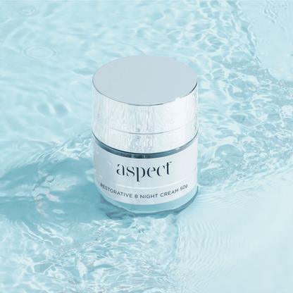 Aspect Restorative 8 Night Cream floating in water, showcasing the luxurious hydrating formula that restores moisture and plumps skin overnight.