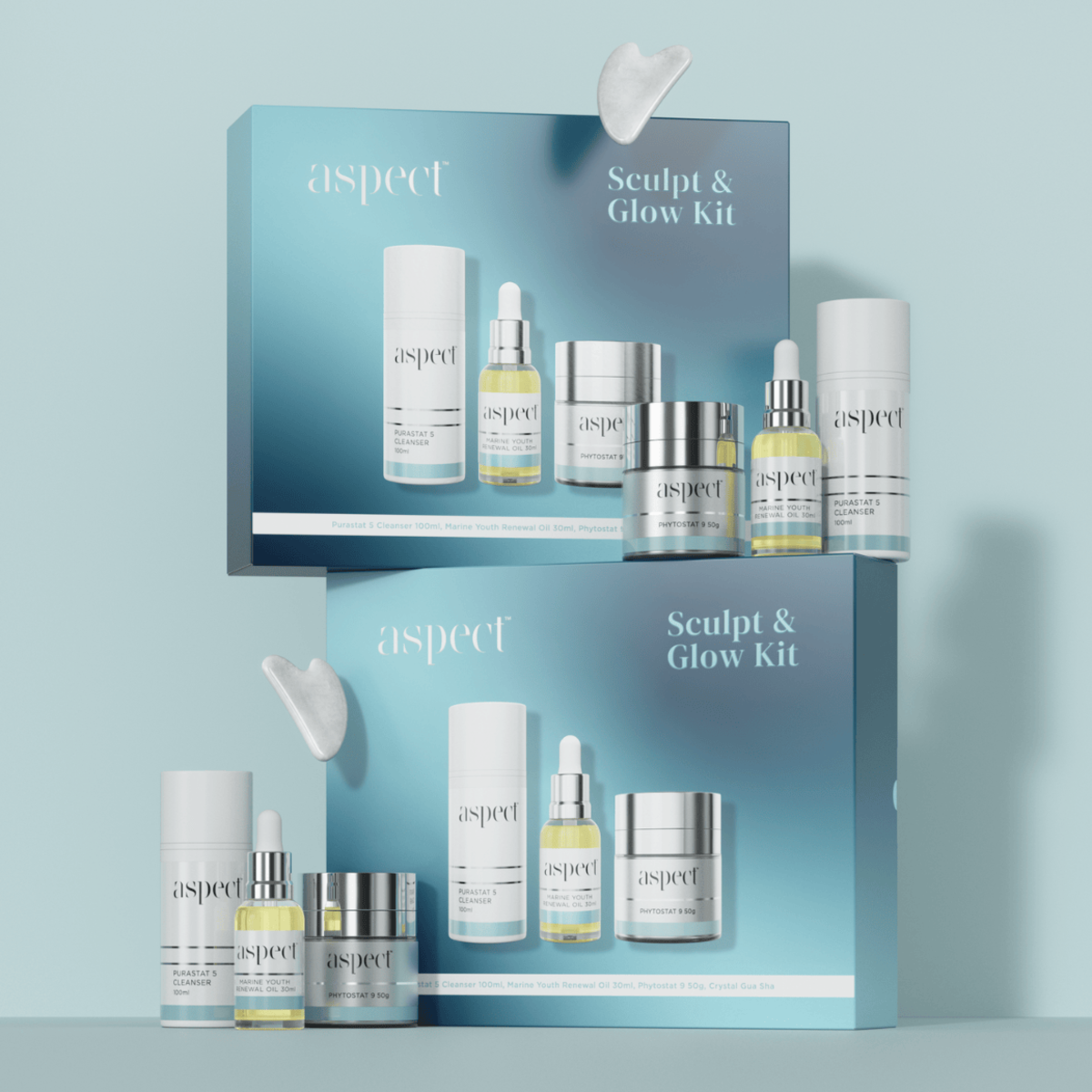 Styled display of two Aspect Sculpt & Glow Limited Edition Kits showcasing the cleanser, marine oil, moisturiser and Gua Sha for radiant, sculpted, glowing skin.