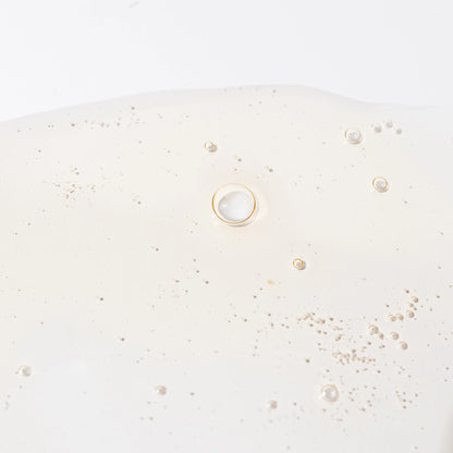 Cosmedix Elite Surface Revival Antioxidant Boosting Toner texture with niacinamide, snow mushroom extract and red algae for hydration and skin smoothing.