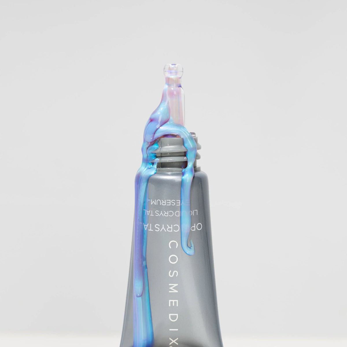 Cosmedix Opti Crystal Liquid Crystal Eye Serum concentrated applicator for targeted treatment of dry, crepey under-eyes.