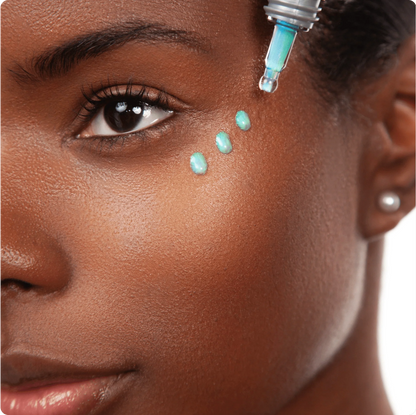 Cosmedix Opti Crystal Liquid Crystal Eye Serum applied around the eye area to brighten dark circles and visible fatigue.