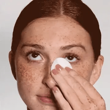 Cosmedix Purity Balance Exfoliating Prep Toner applied with cotton pad for exfoliating toner step, clarifying congested skin and refining oily, acne-prone or combination skin.