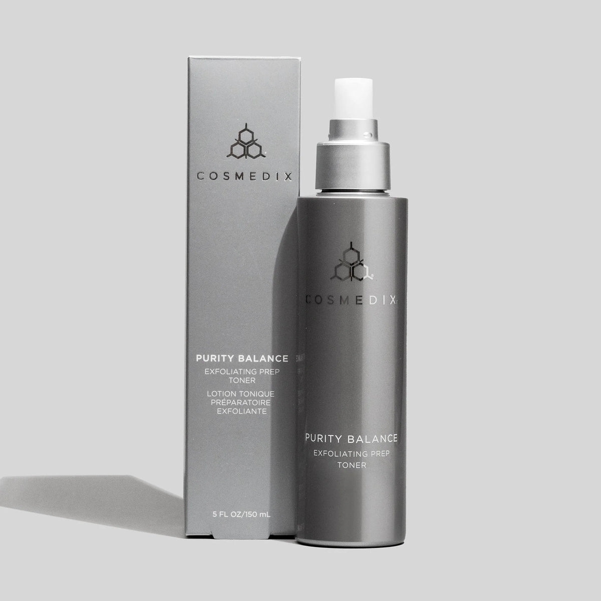 Cosmedix Purity Balance Exfoliating Prep Toner 150ml, clarifying exfoliating toner with tea tree oil and niacinamide beside product carton.