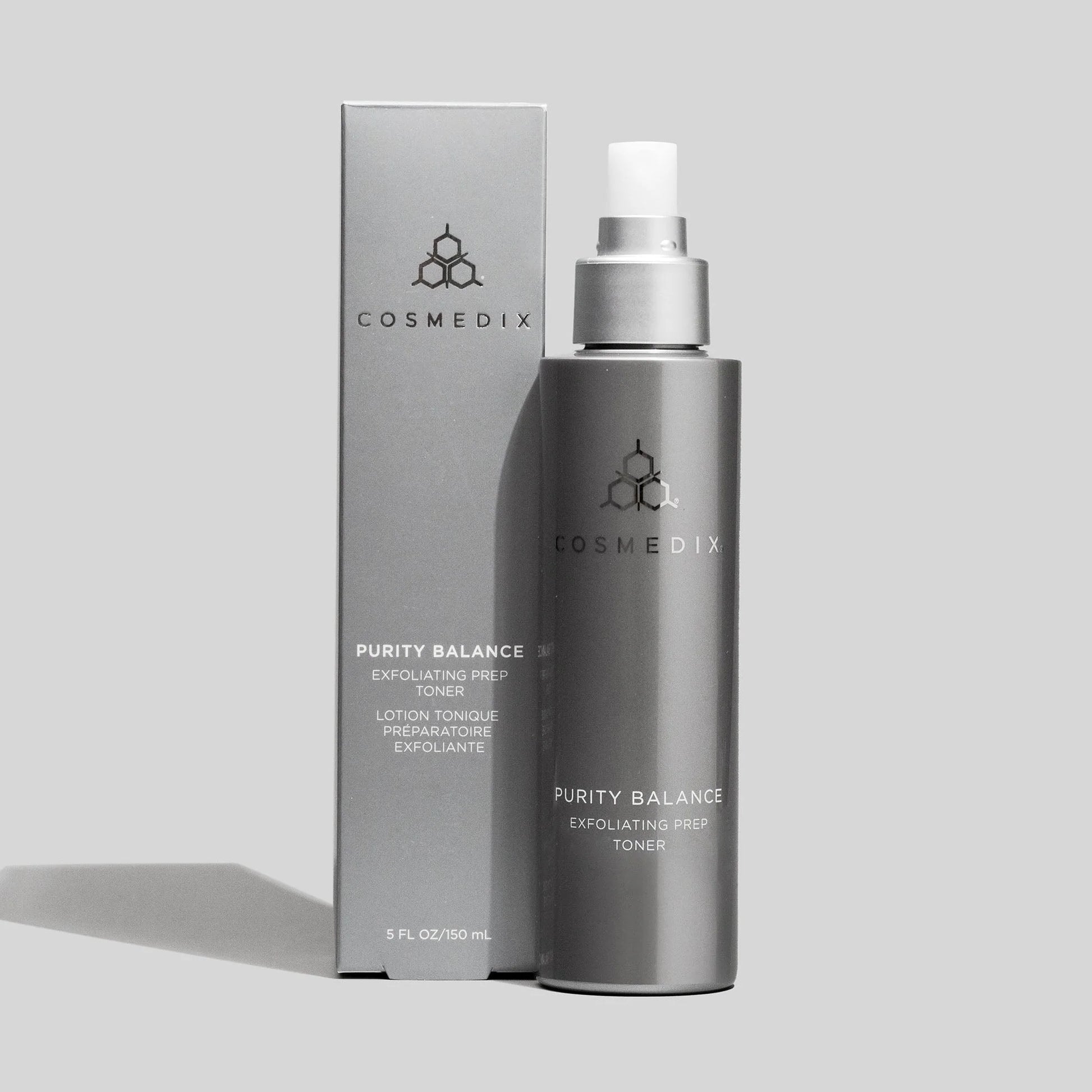 Cosmedix Purity Balance Exfoliating Prep Toner 150ml, clarifying exfoliating toner with tea tree oil and niacinamide beside product carton.