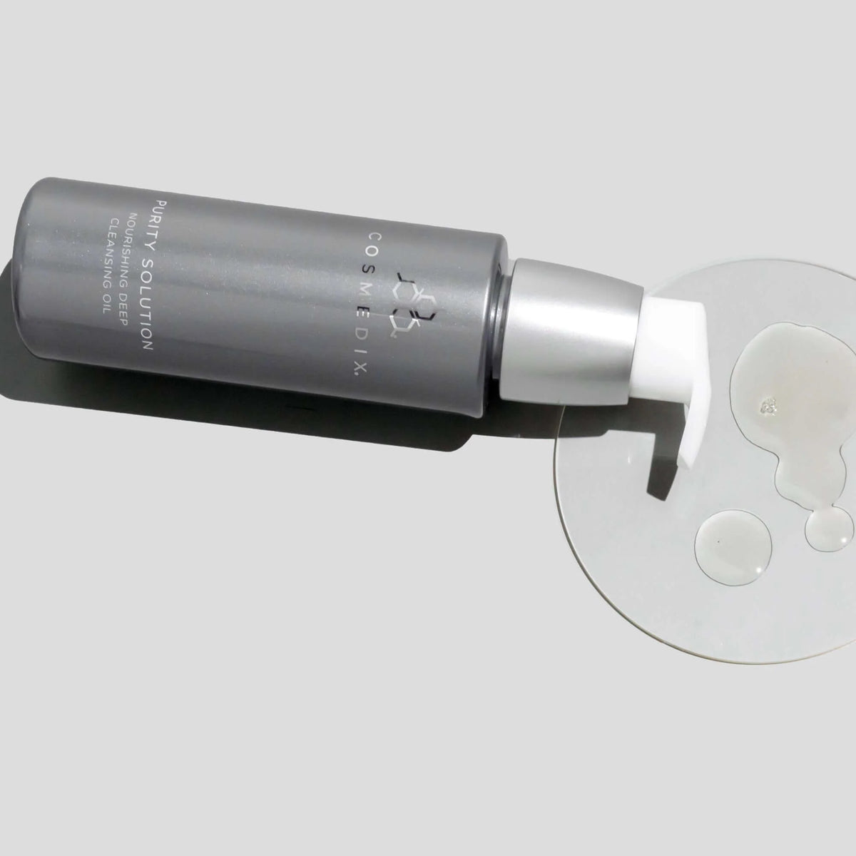 Cosmedix Purity Solution Nourishing Cleansing Oil 100ml bottle with cleansing oil texture for first cleanse and sunscreen removal.  