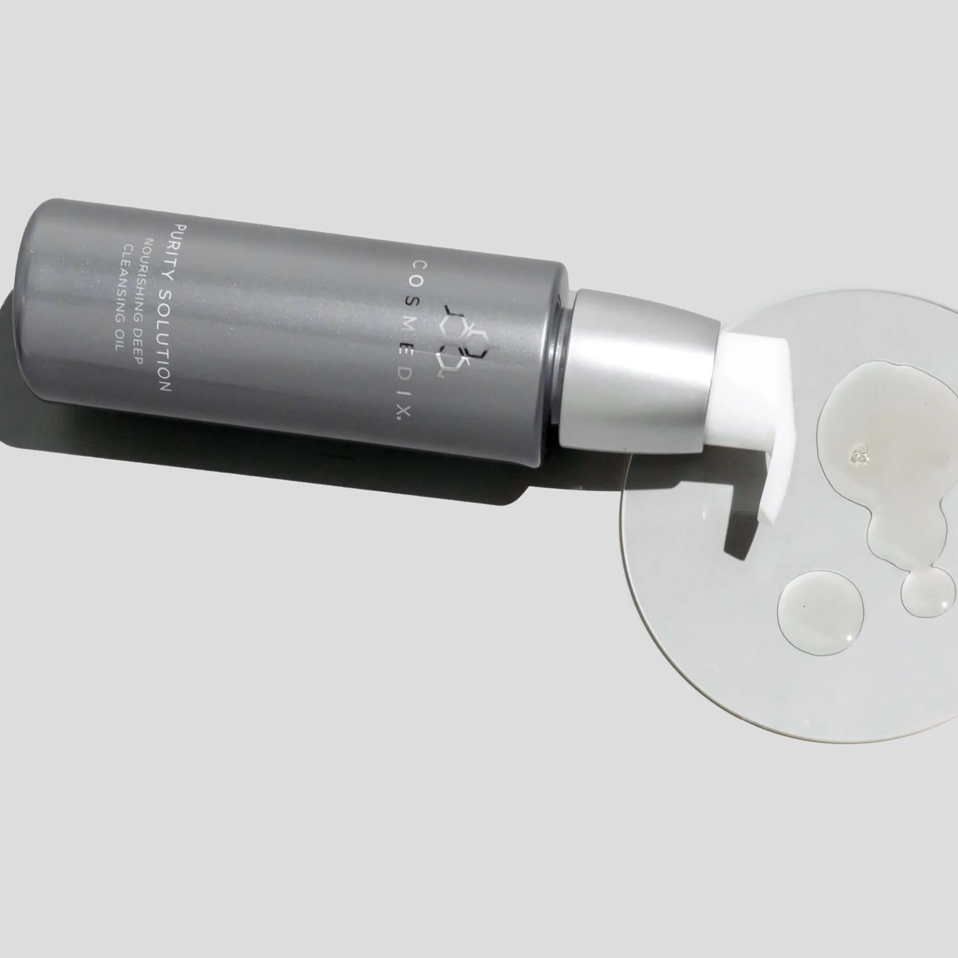 Cosmedix Purity Solution Nourishing Cleansing Oil 100ml bottle with cleansing oil texture for first cleanse and sunscreen removal.  