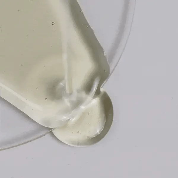 Cosmedix Purity Solution Nourishing Cleansing Oil pouring texture showing lightweight cleansing oil consistency.