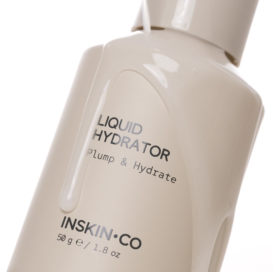 INSKIN.CO Liquid Hydrator close up with liquid product dripping over bottle highlighting fluid texture and intensive hydration.