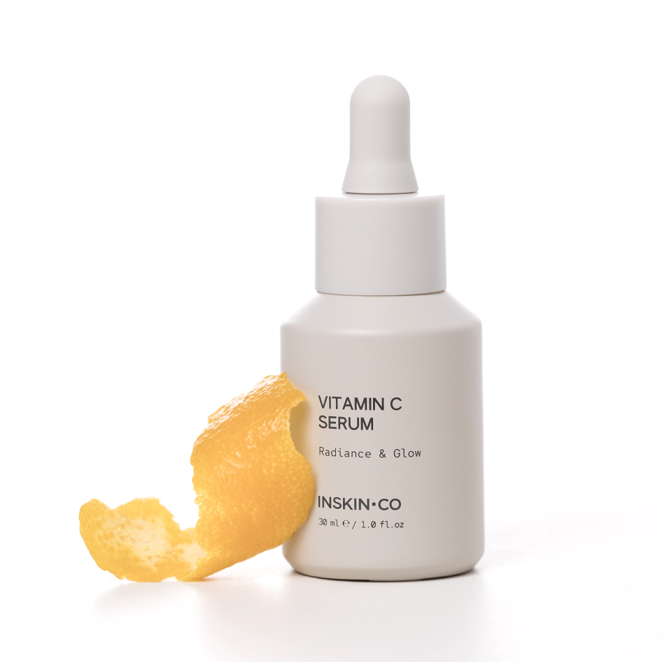 INSKIN.CO Vitamin C Serum styled with citrus peel highlighting vitamin C antioxidant skincare for radiant, healthy-looking skin.