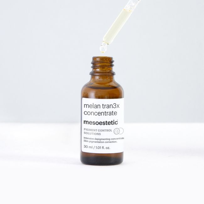 Mesoestetic Melan Tran3x Concentrate with dropper, an intensive pigment-correction serum for dark spots, post-acne marks and uneven skin tone.