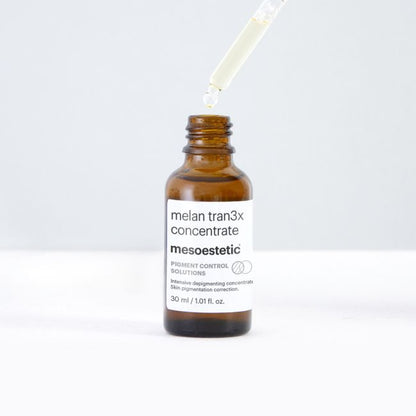 Mesoestetic Melan Tran3x Concentrate with dropper, an intensive pigment-correction serum for dark spots, post-acne marks and uneven skin tone.