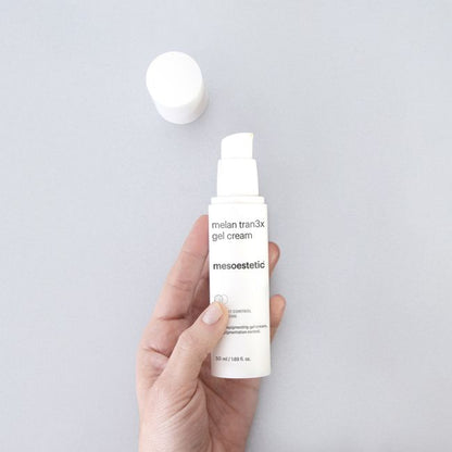 Mesoestetic Melan Tran3x Gel Cream held in hand, a lightweight depigmenting gel cream for daily use on pigmentation and dark spots.