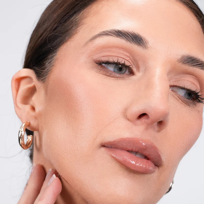 O Cosmedics 1SKIN Lotus Skin Primer for a natural satin finish that softens visible texture and enhances skin radiance beneath makeup.