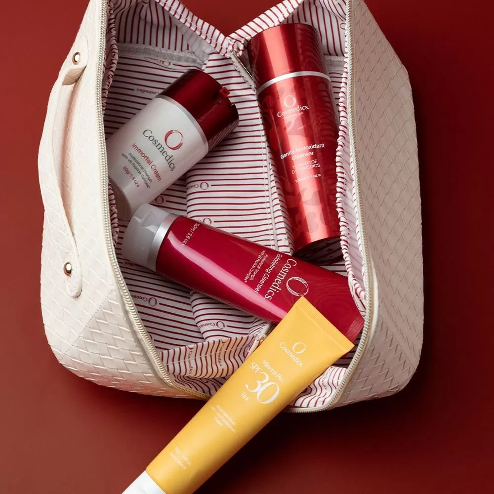 O Cosmedics Core Four collection inside free travel bag