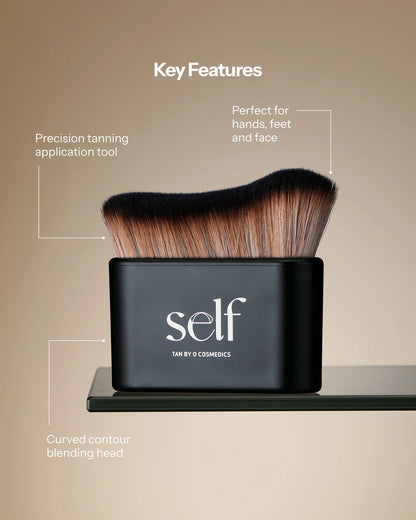 O Cosmedics SELF Tanning Brush, a precision self-tanning applicator with curved blending bristles for streak-free colour on the face, hands and feet.