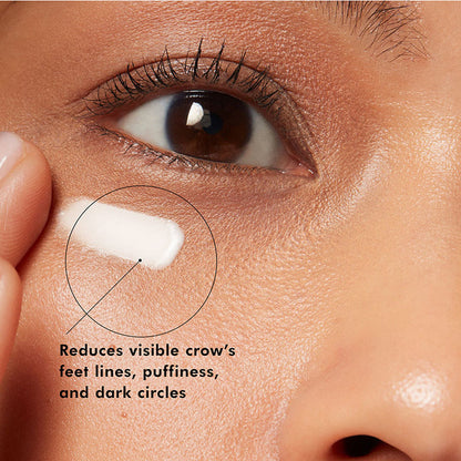 SkinCeuticals A.G.E. Advanced Eye Cream shown on skin to reduce visible crow’s feet, puffiness and dark circles around the eye area.