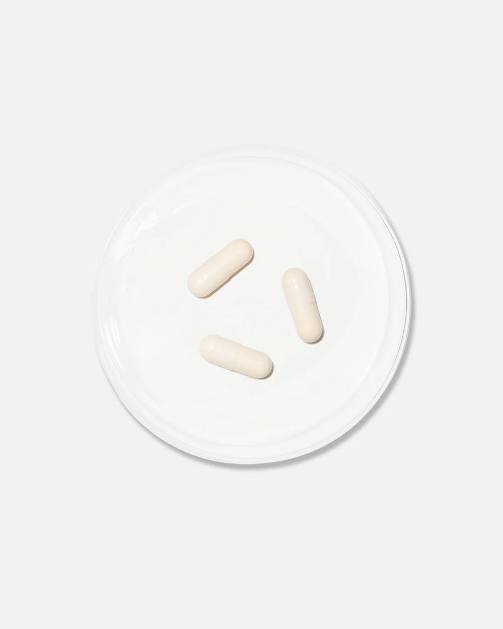 Vida Glow Advanced Repair Luminous capsules shown close-up to represent daily antioxidant support for brighter, more luminous skin.