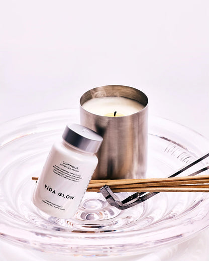 Vida Glow Advanced Repair Luminous styled in a premium beauty setting to reflect daily ingestible support for brighter, more radiant-looking skin.