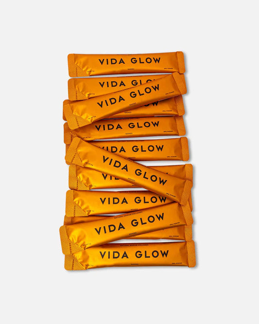 Vida Glow Natural Marine Collagen - Mango collagen powder texture showing finely milled flavoured marine collagen supplement.